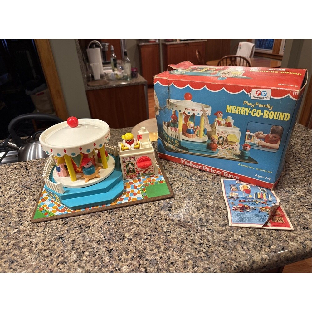 Fisher-Price merry-go-round w/ box & original wooden people. Works great!  1972